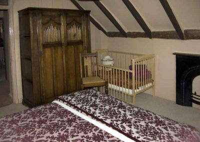 Cot in one of the double bedrooms