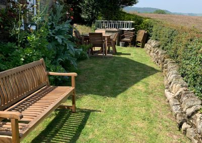 Garden seating with sea views, Holly Cottage, Boggle Hole